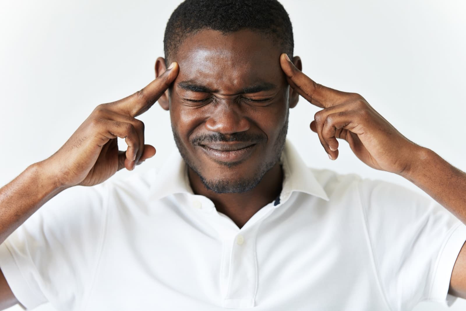 Man with a headache — pain relief at Medhour Pharmacy